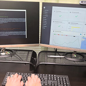 Person working on dual monitors